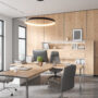 Wooden office interior with consulting zone and armchairs, panoramic window