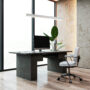 Modern office desk with computer and chair by large window. 3D Rendering