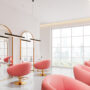 Luxury beauty salon interior with armchairs, cosmetics and panoramic window