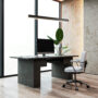 Modern office desk with computer and chair by large window. 3D Rendering