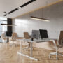 Stylish business interior with armchairs and desk, pc monitors and sideboard