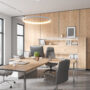 Wooden office interior with consulting zone and armchairs, panoramic window